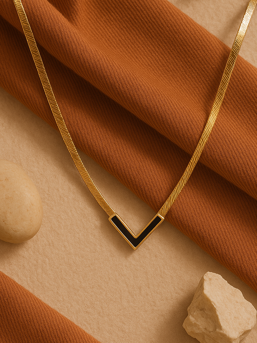 Elegant gold V shaped bold necklace with black crystals