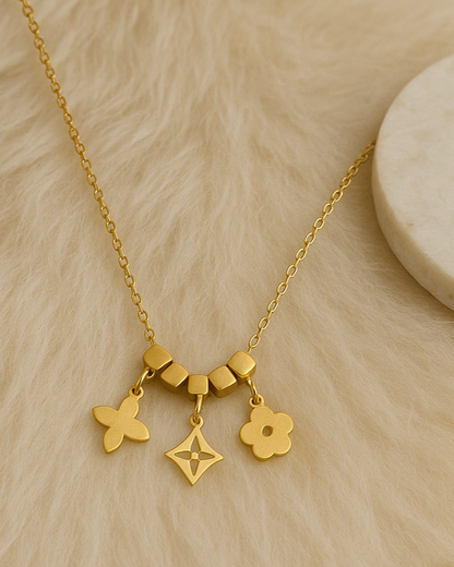 Floral charm necklace with solid cubes