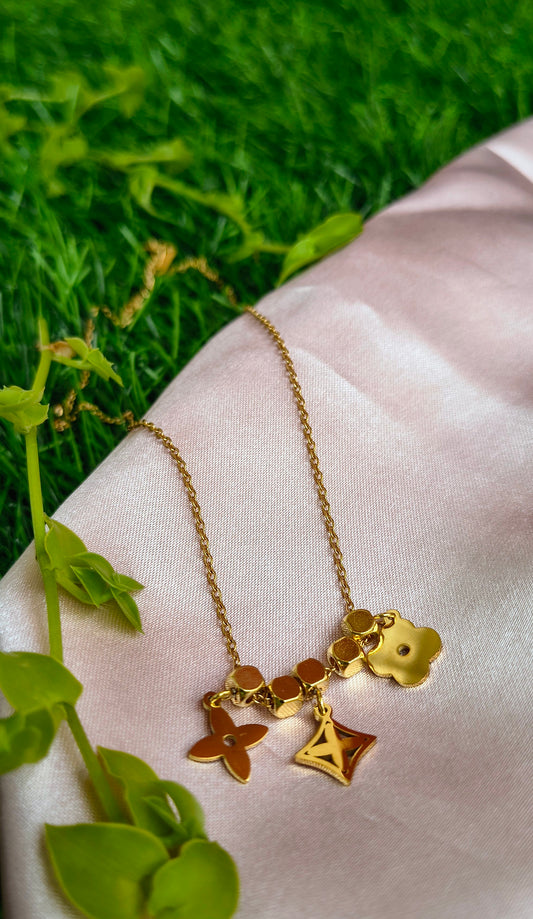 Floral charm necklace with solid cubes